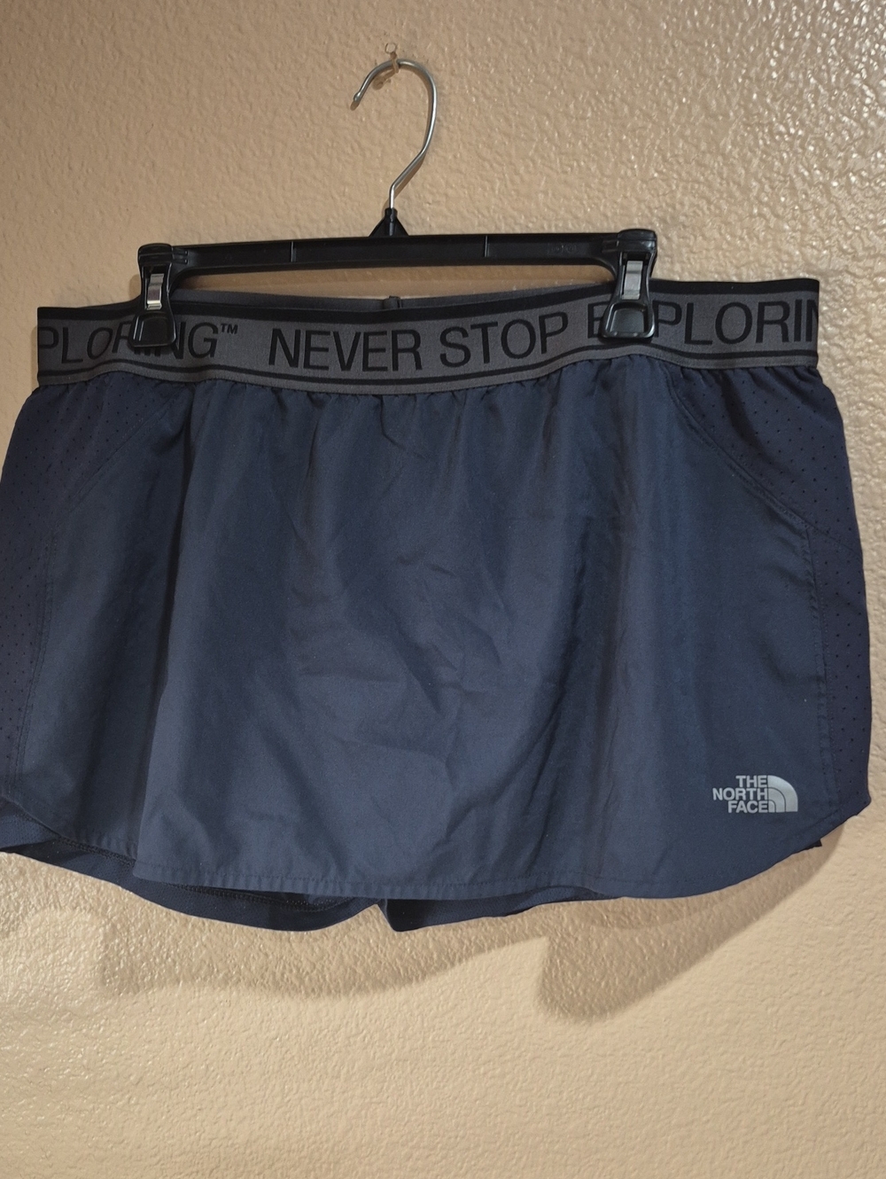 The North Face Navy Performance Skort with 'Never Stop Exploring' Waistband